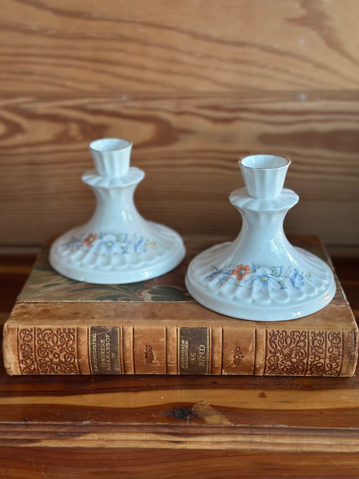 Vintage Royal Stewart candlesticks crafted from fine bone china, featuring delicate floral patterns. A timeless Irish home decor piece.