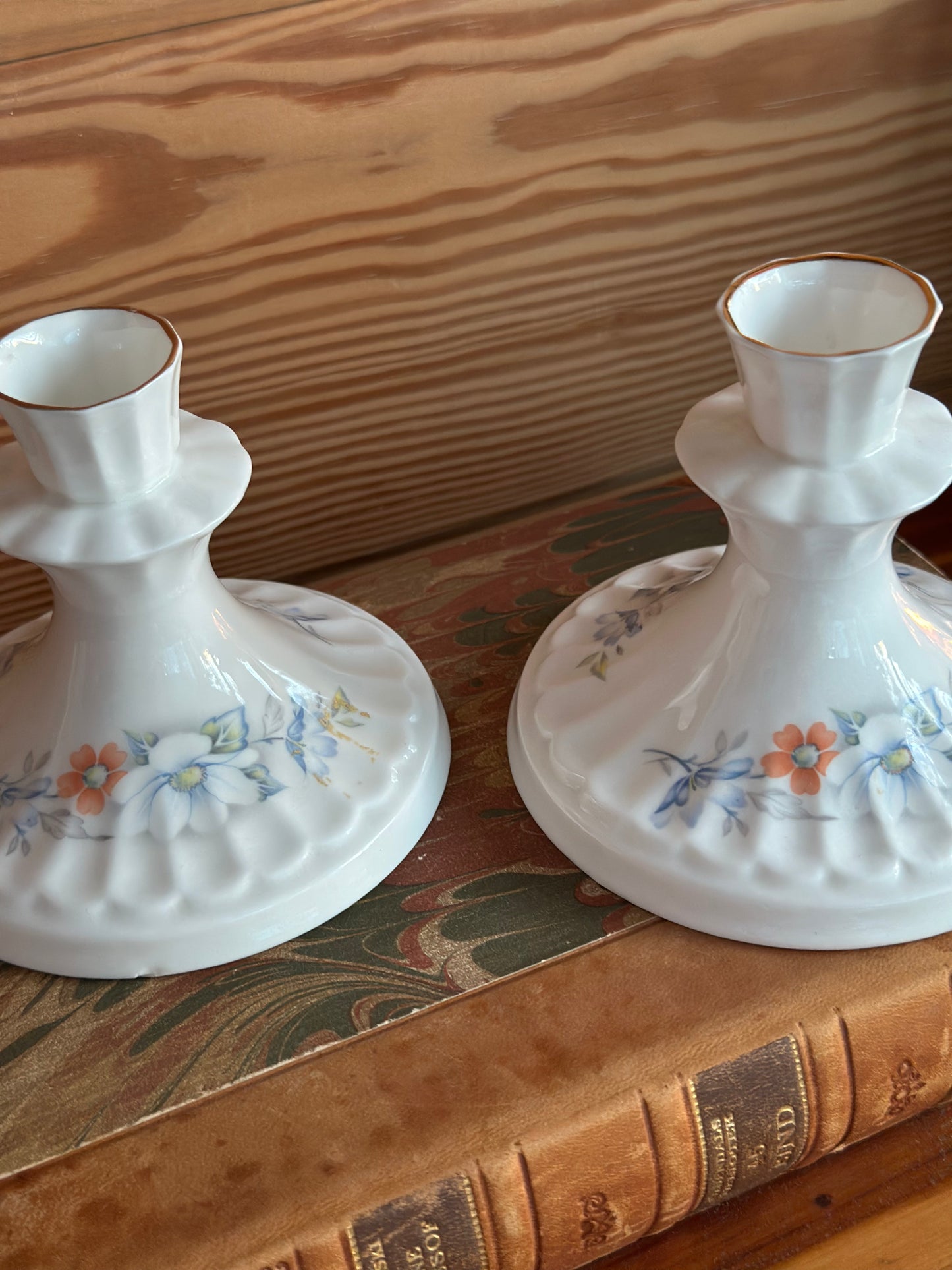 Set of two Vintage Royal Stewart bone china candlesticks with intricate floral designs. Elegant Irish craftsmanship for classic home decor.