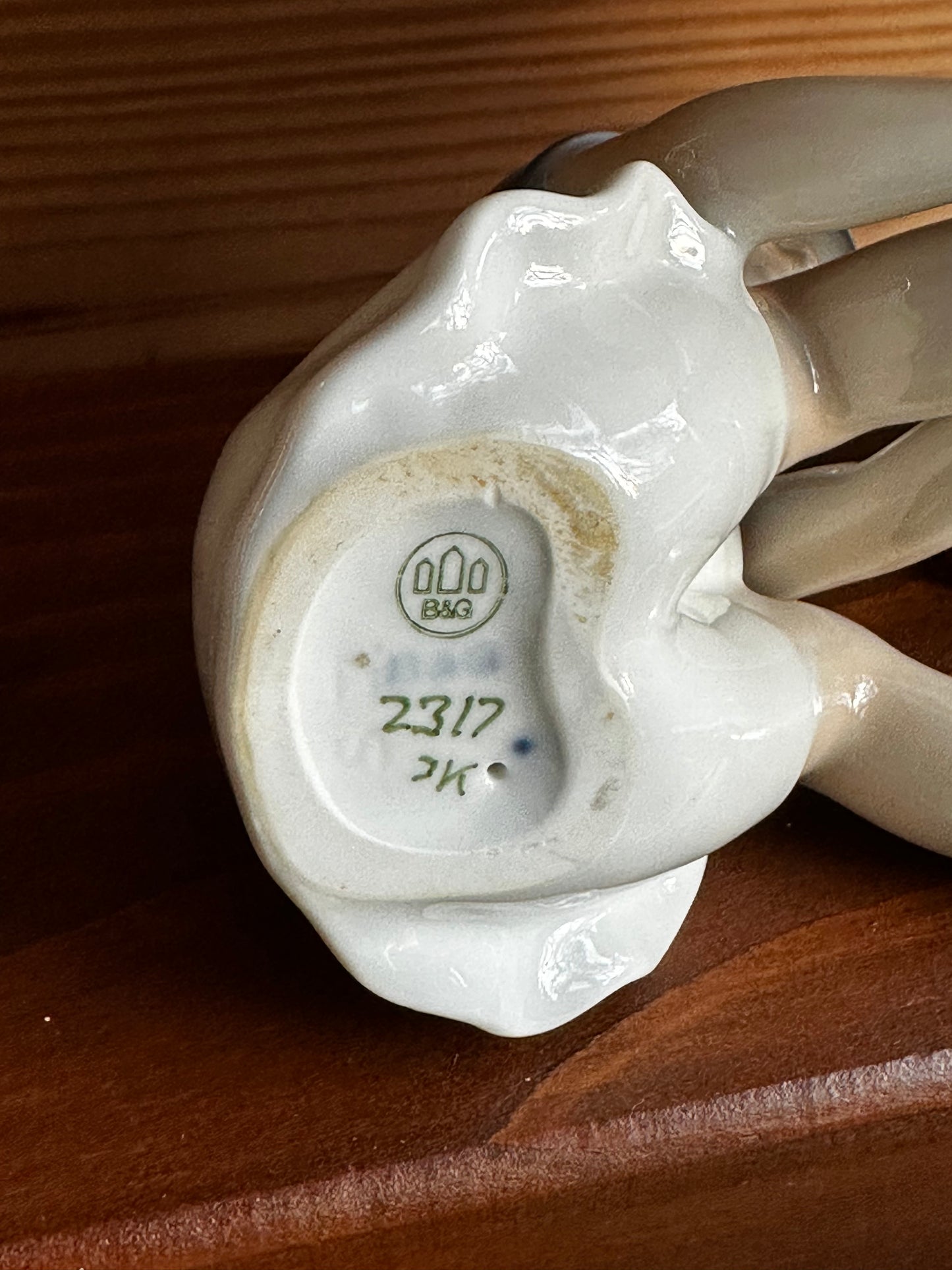 Close-up of the B&G porcelain figurine's base, showcasing the maker's mark and model number 2317. A collectible vintage home decor item.