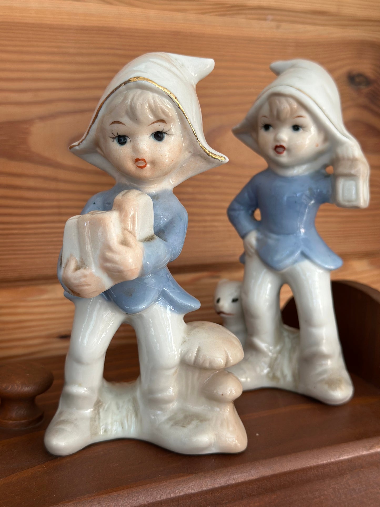 Vintage porcelain figurines of LEGO Forest Pixie Elves, 5.5 inches tall, featuring intricate details and whimsical forest-themed design in blue and white.