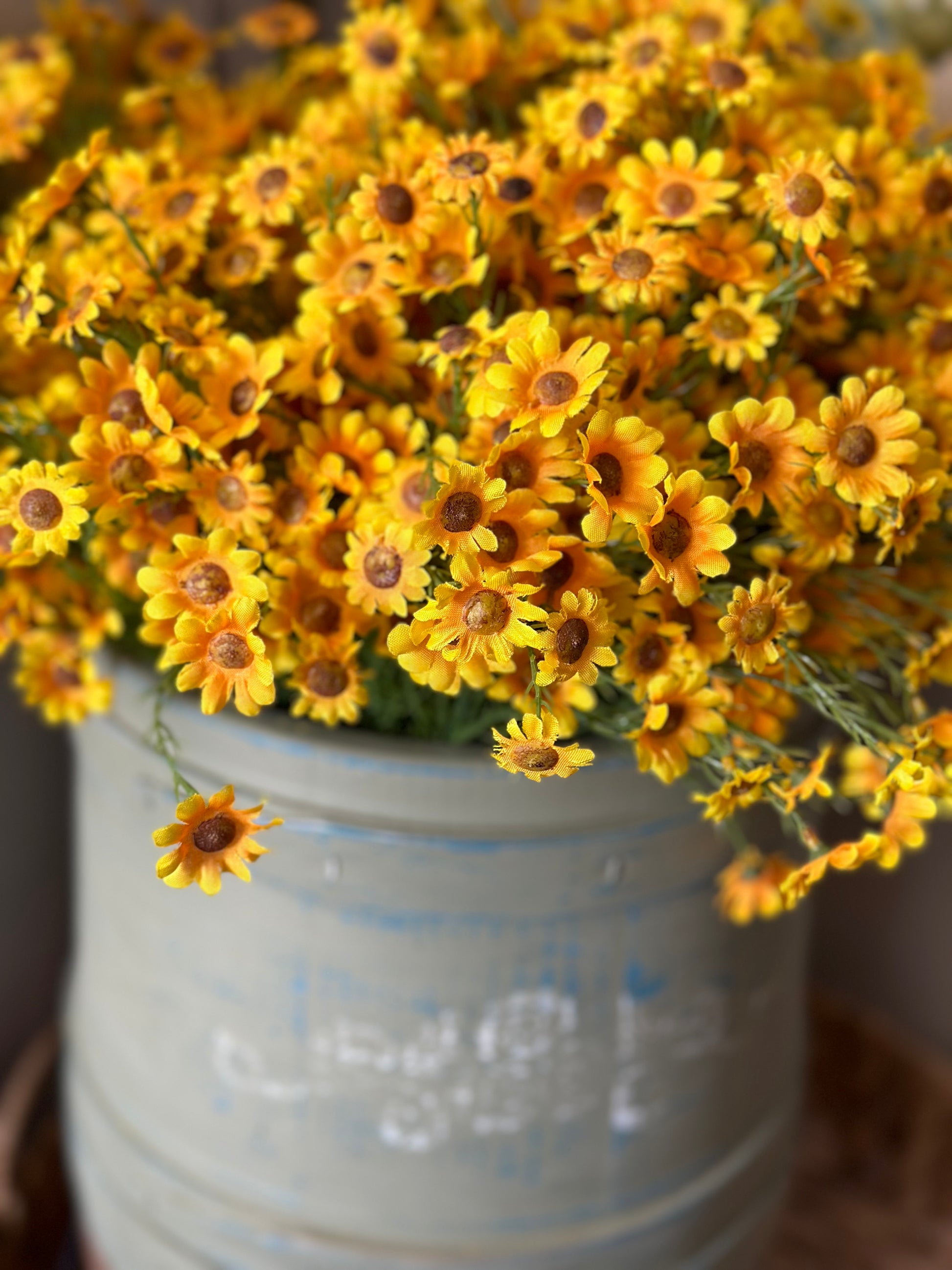 Lush Yellow Daisy Bush 15-inch artificial flowers arranged in a decorative pot, ideal for brightening indoor spaces with lifelike beauty.