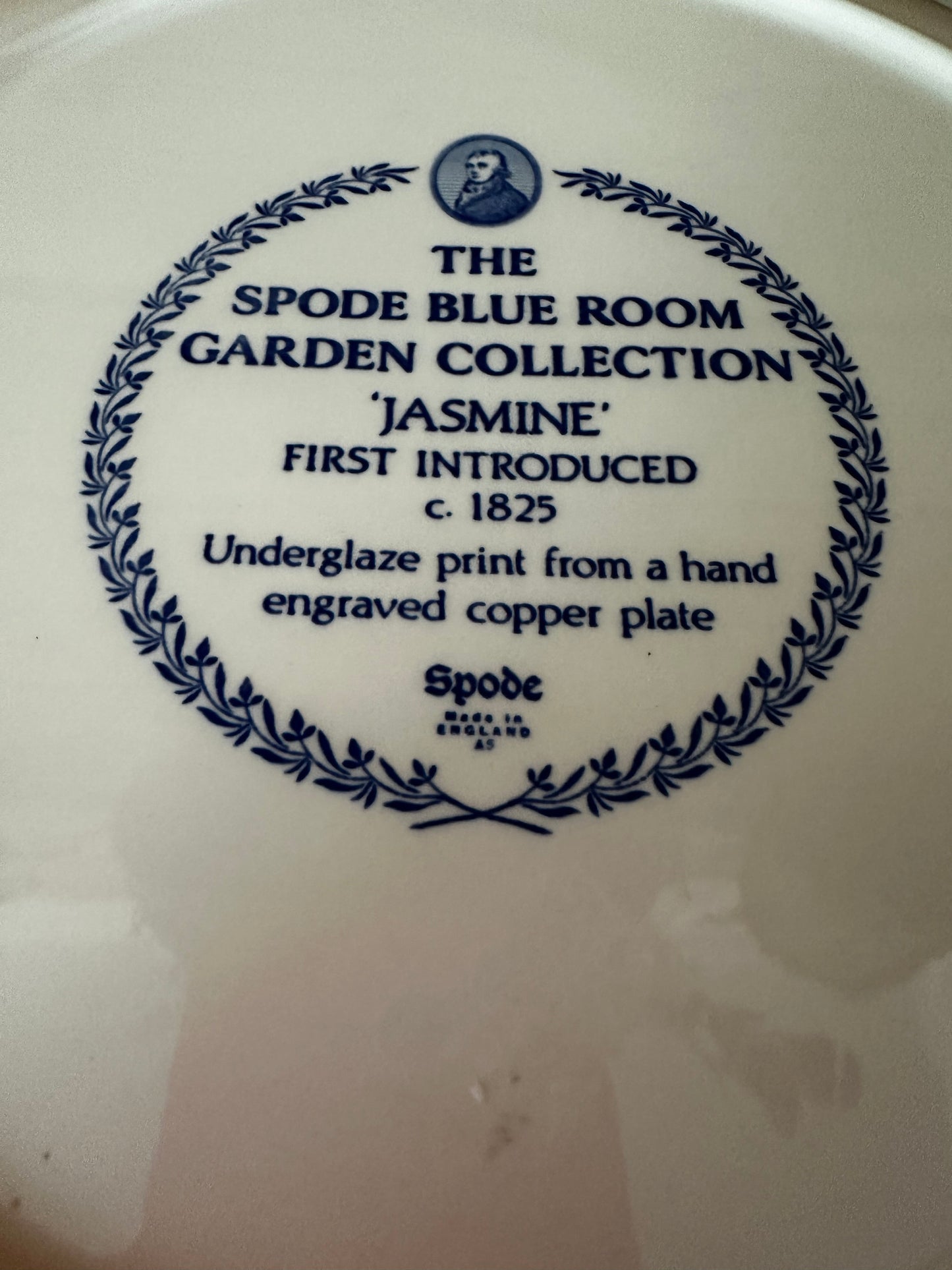Backstamp of Spode Blue Room Garden Collection 'Jasmine' platter, detailing its historical design first introduced in 1825 with underglaze print.