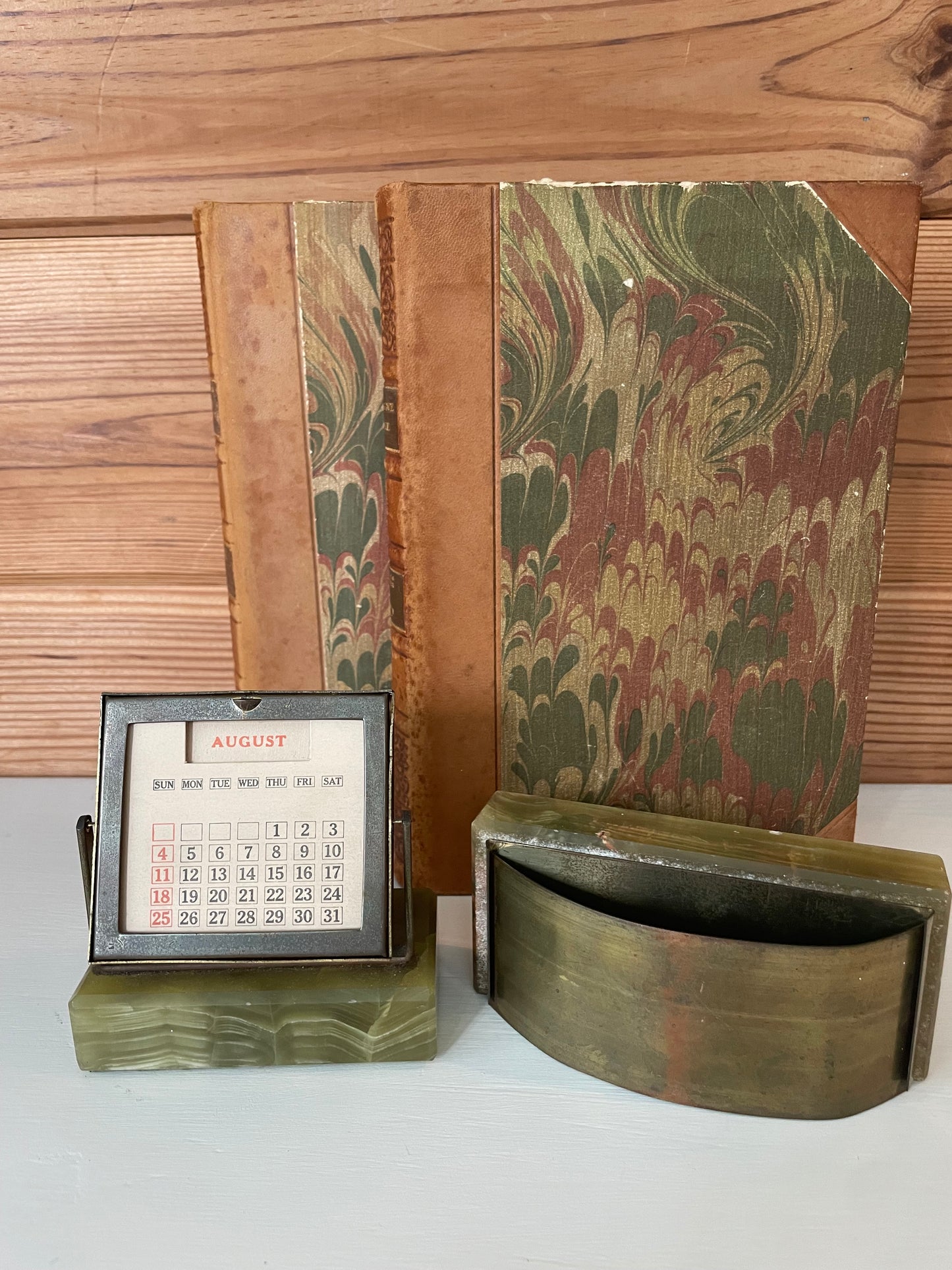 Retro green marble perpetual calendar and ink blotter set, perfect for vintage-inspired office decor and organization.