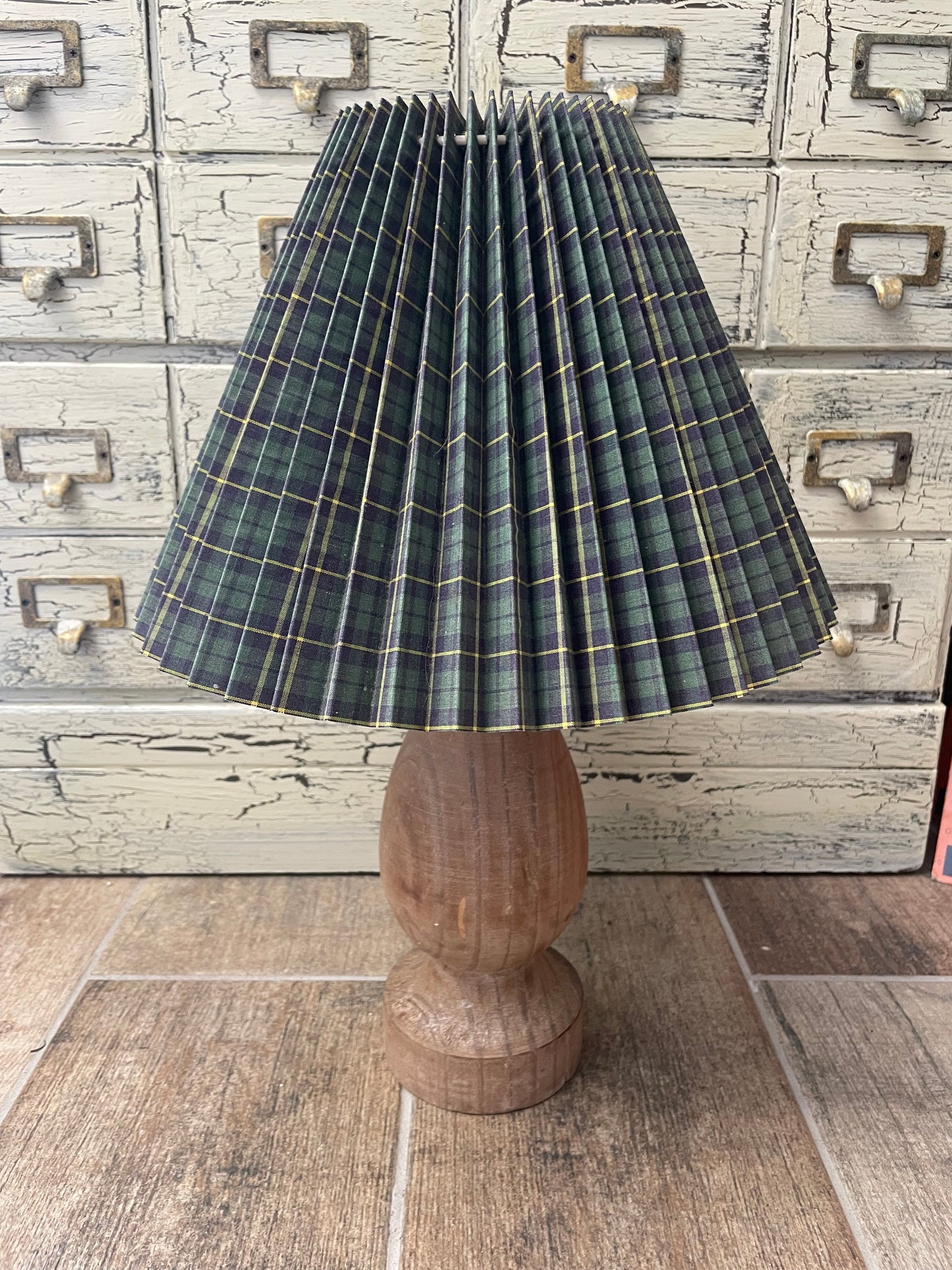 Everly Candle Holder 11.75 inch repurposed as a lamp base with a plaid pleated shade. A versatile wooden-style decor piece for home interiors.