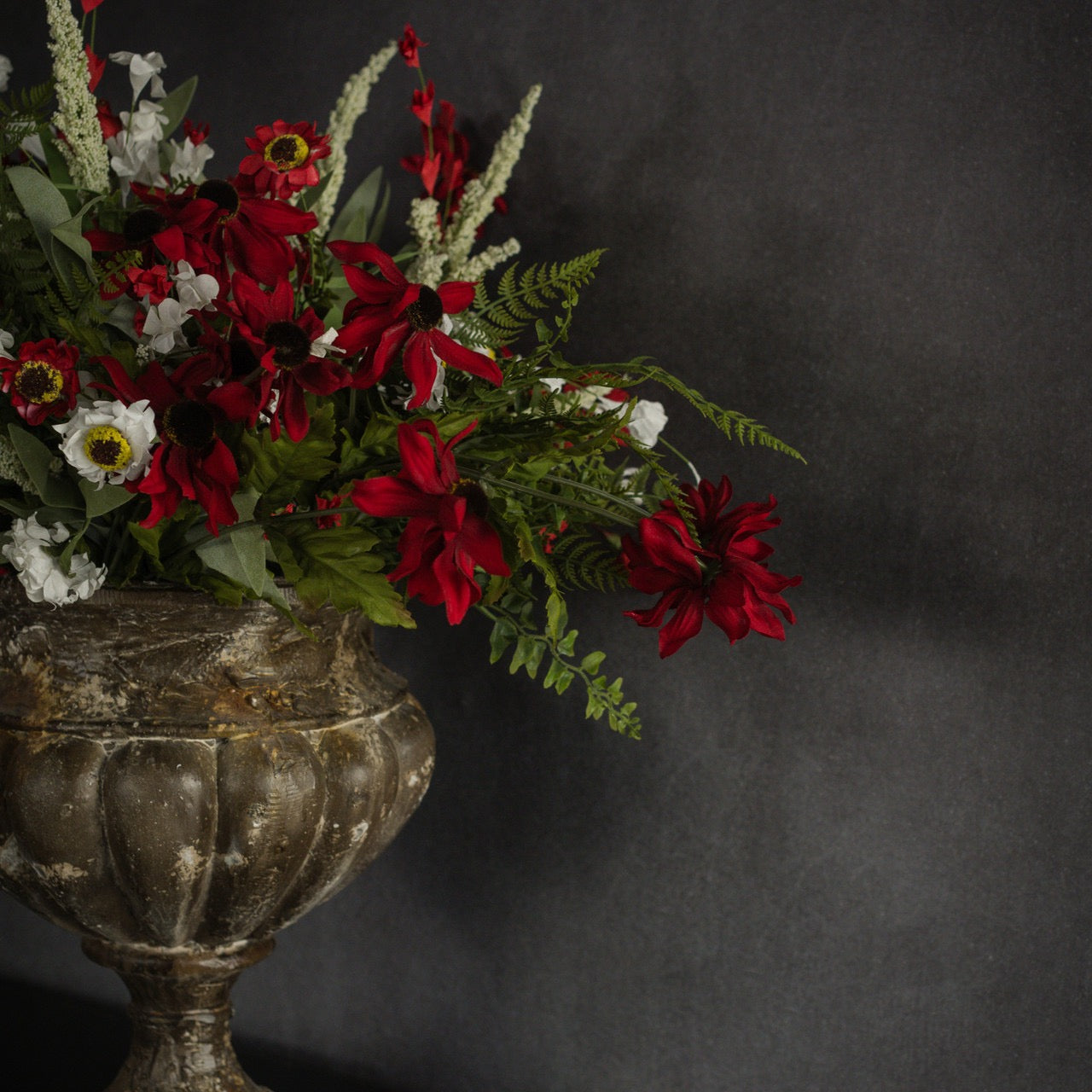15-inch Buckler Fern Bush mixed with vibrant red and white artificial flowers in an ornate vase. Enhances floral arrangements with natural charm.