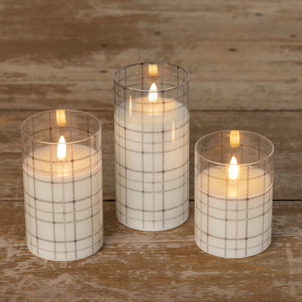 Set of Andri Plaid Glass 3D Flame Candles in varying sizes, featuring a cozy plaid design and realistic flameless glow for stylish home decor.