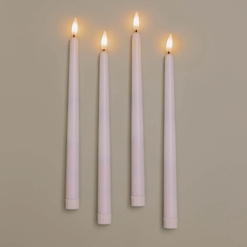 Set of four Antique Candle Co. flameless taper candles with realistic flickering LED flames, perfect for elegant home decor.