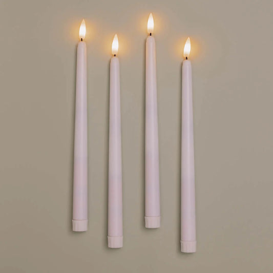 Set of four Antique Candle Co. flameless taper candles with realistic flickering LED flames, perfect for elegant home decor.