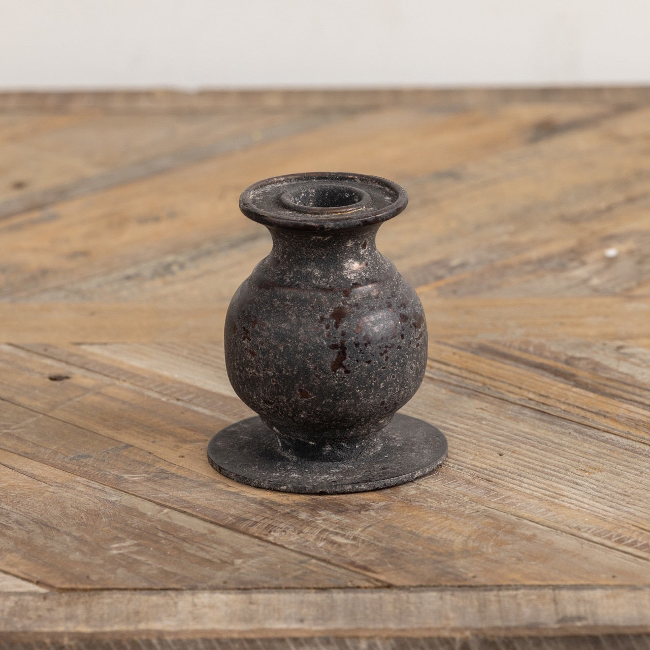Close-up of the 3.5-inch Jasper taper candle holder, showcasing its textured metal finish and elegant, rounded design for a timeless look.