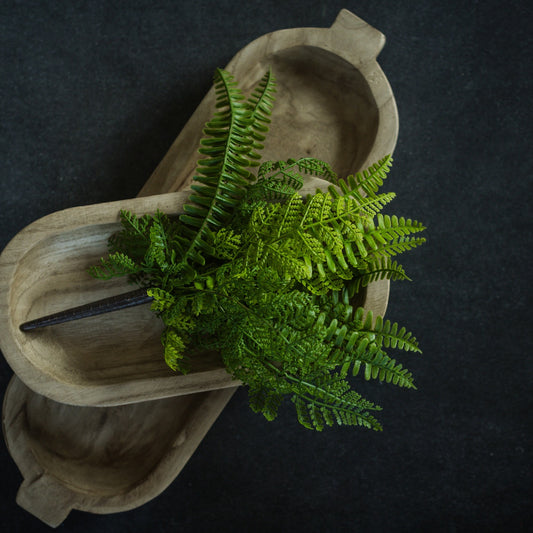 Lifelike 12-inch Sword Fern & Cedar Bush displayed in a wooden dough bowl. Perfect for home decor with a natural, rustic touch.