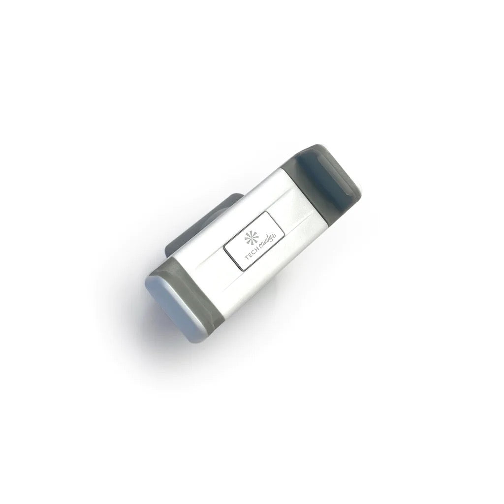 TECH CANDY ROLL WITH IT compact mobile phone holder with a sleek silver and gray design. Ideal for hands-free convenience and secure grip.