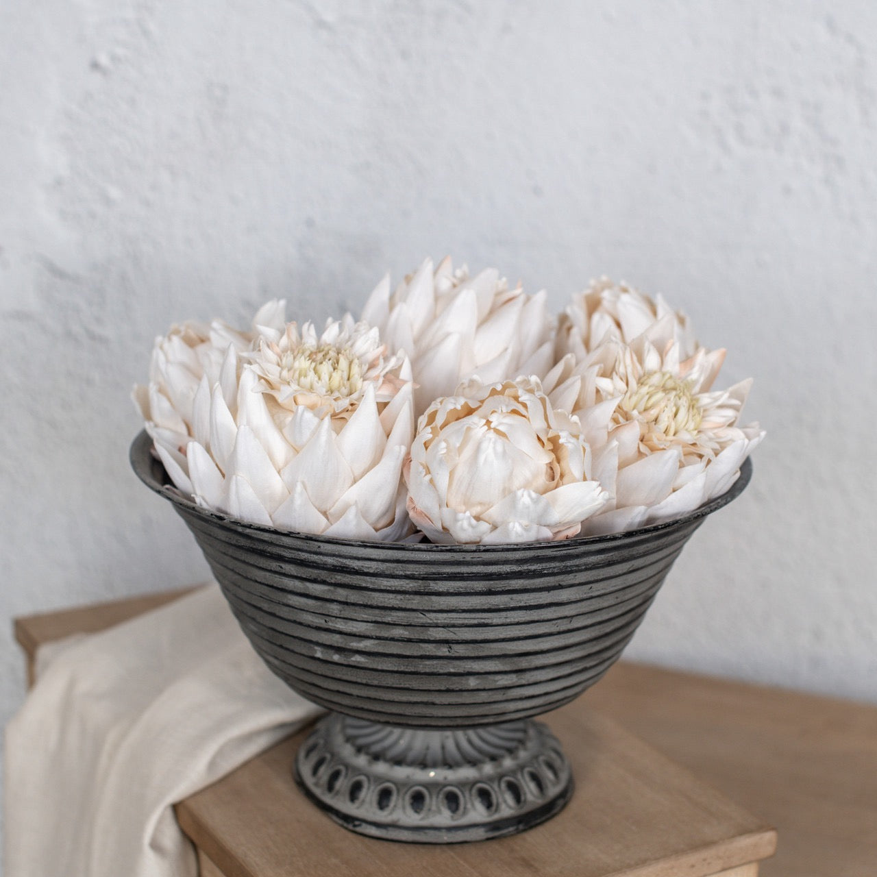 Bowl filled with cream artichoke head decorations, 4.5 inches each. Perfect artificial floral arrangement for home and garden styling.