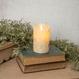 5-inch moving flame cream candle with a realistic flickering effect, placed on vintage books with greenery. Made of plastic and wax, perfect for home decor.