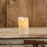 Rustic-style 5-inch moving flame cream candle with a flickering flame effect, placed on a distressed wooden surface. A perfect addition to farmhouse decor.