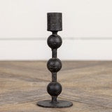 6-inch sculpted taper candlestick in black metal with a unique stacked sphere design. A stylish candle holder for elegant home decor.