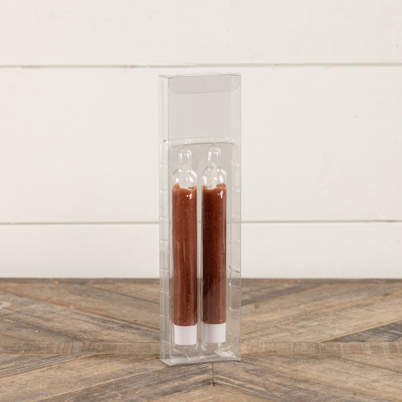 Packaged set of two 6.75-inch moving flame bronze taper candles in a clear plastic case. A stylish and safe alternative to traditional candles for home decor.