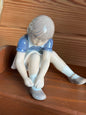 Vintage Figurine - Girl Buttoning Shoes