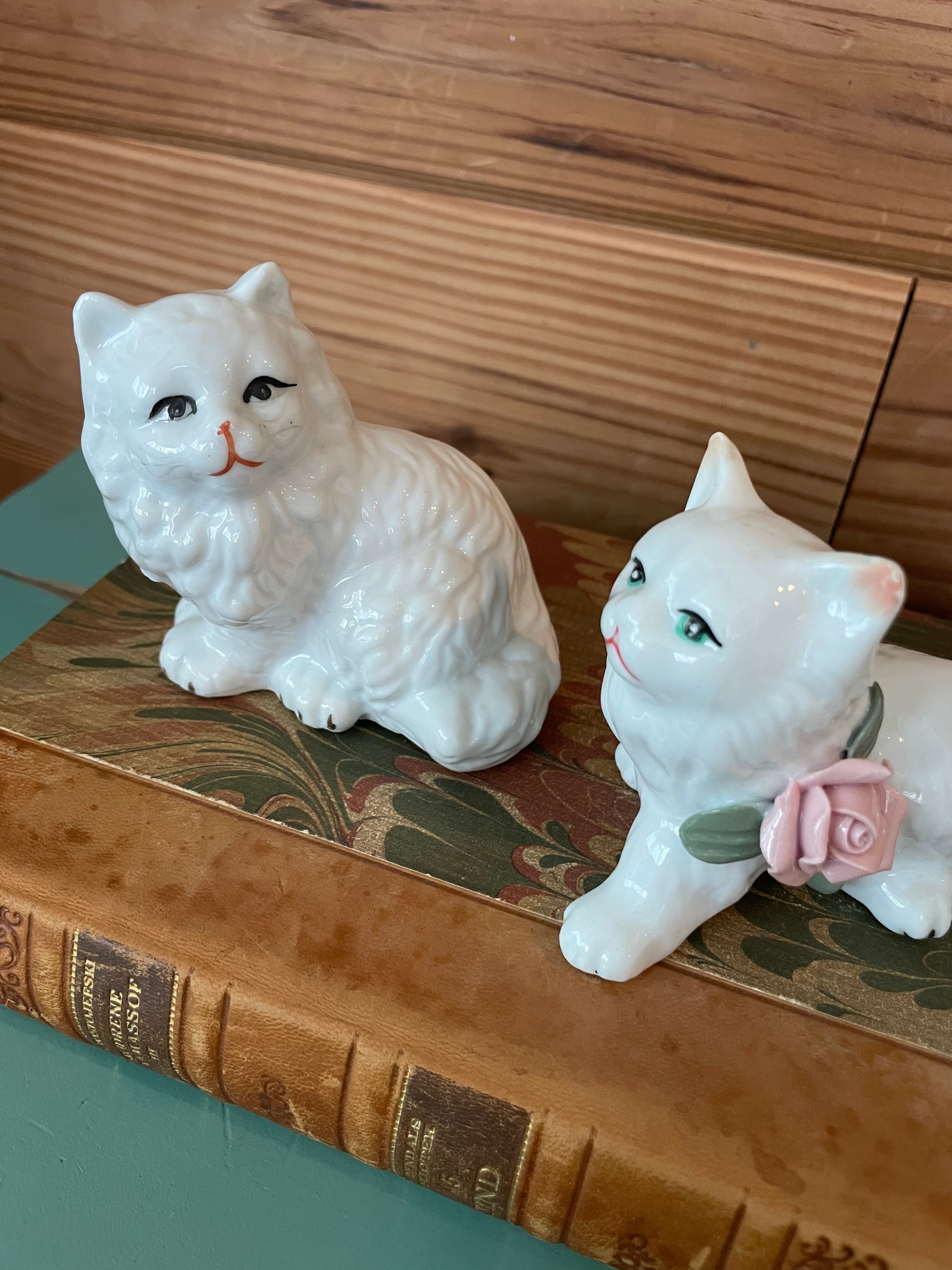 Close-up of vintage ceramic cat figurines with delicate hand-painted details. A charming addition to any vintage decor collection.