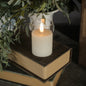 Elegant 3-inch Glass 3D Flame Candle with a realistic moving flame effect, placed on vintage books with greenery in the background.