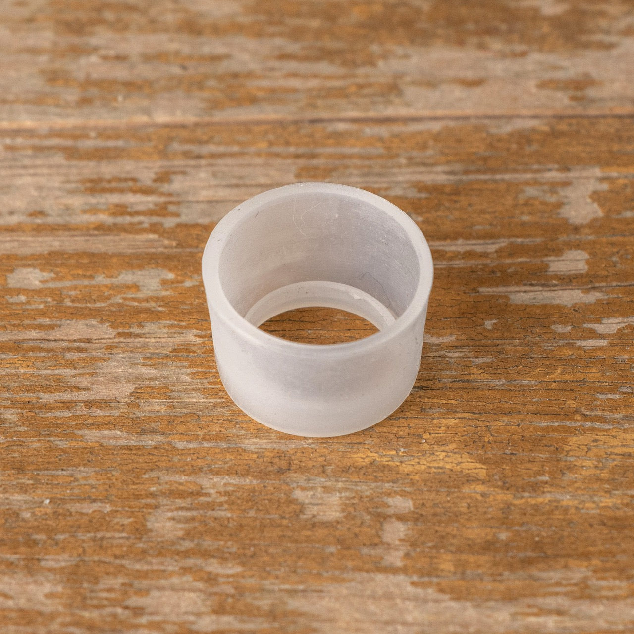 Single translucent Taper Candle Cap, crafted to fit most standard taper candles. A practical accessory for preventing wax drips and ensuring a clean display.