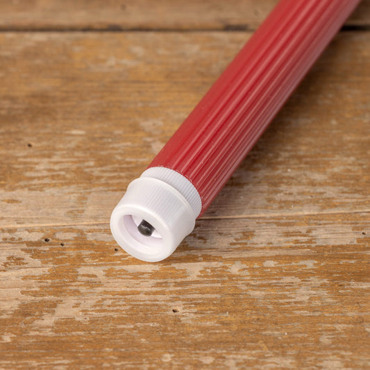 Taper Candle Cap securely fitted on a red taper candle, designed to catch wax drips and provide a polished finish. Ideal for enhancing candle longevity.