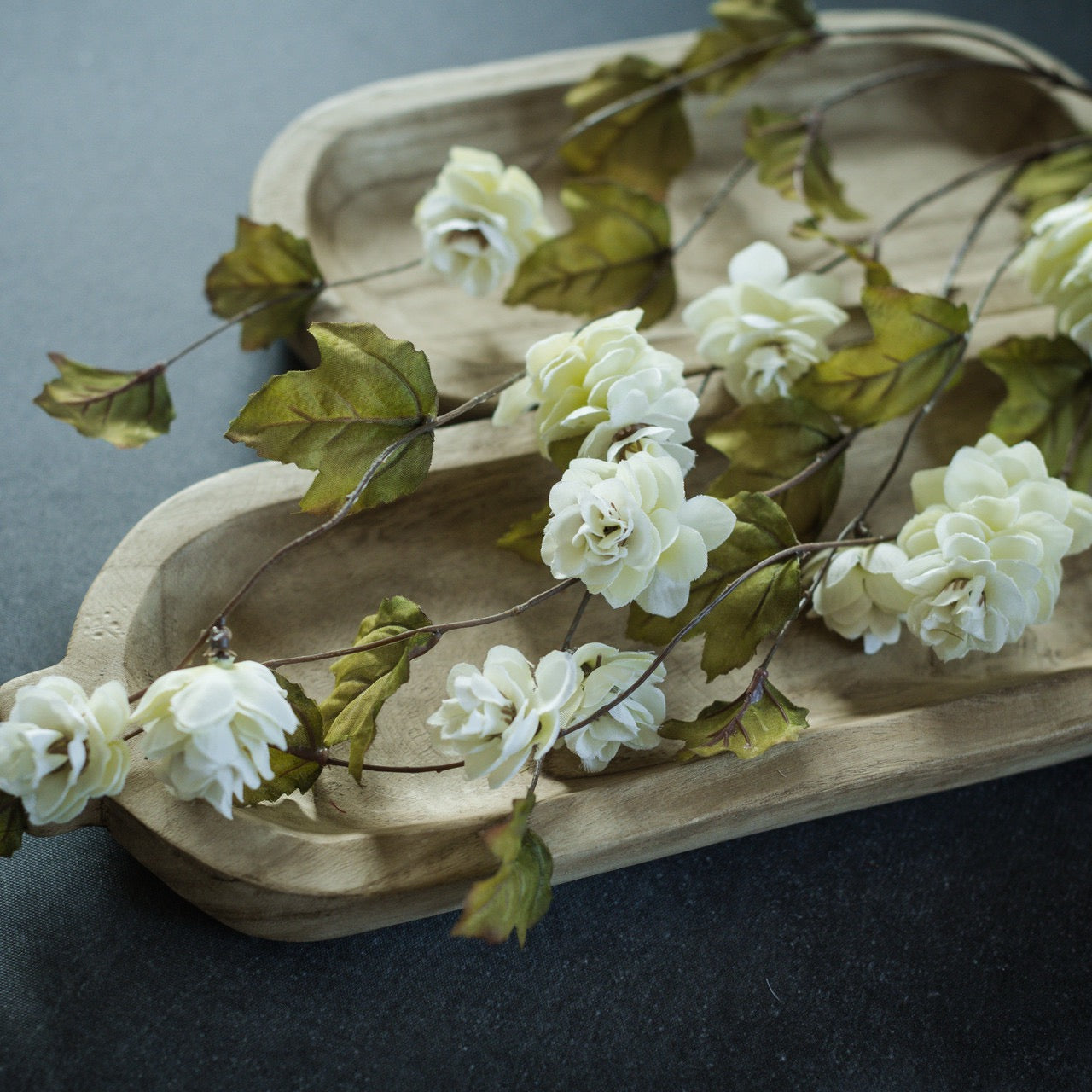 Close-up of Cream Hops Stem on a wooden tray, highlighting its intricate artificial floral details and lifelike texture for home decor.