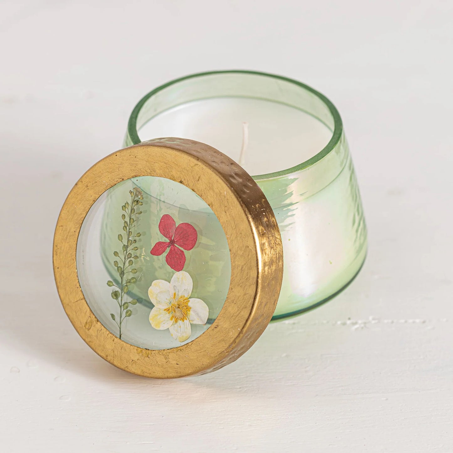 Handcrafted Rosy Rings Tomato Vine Candle with a decorative floral lid. Made with a coconut wax blend for a long-lasting, fragrant burn.