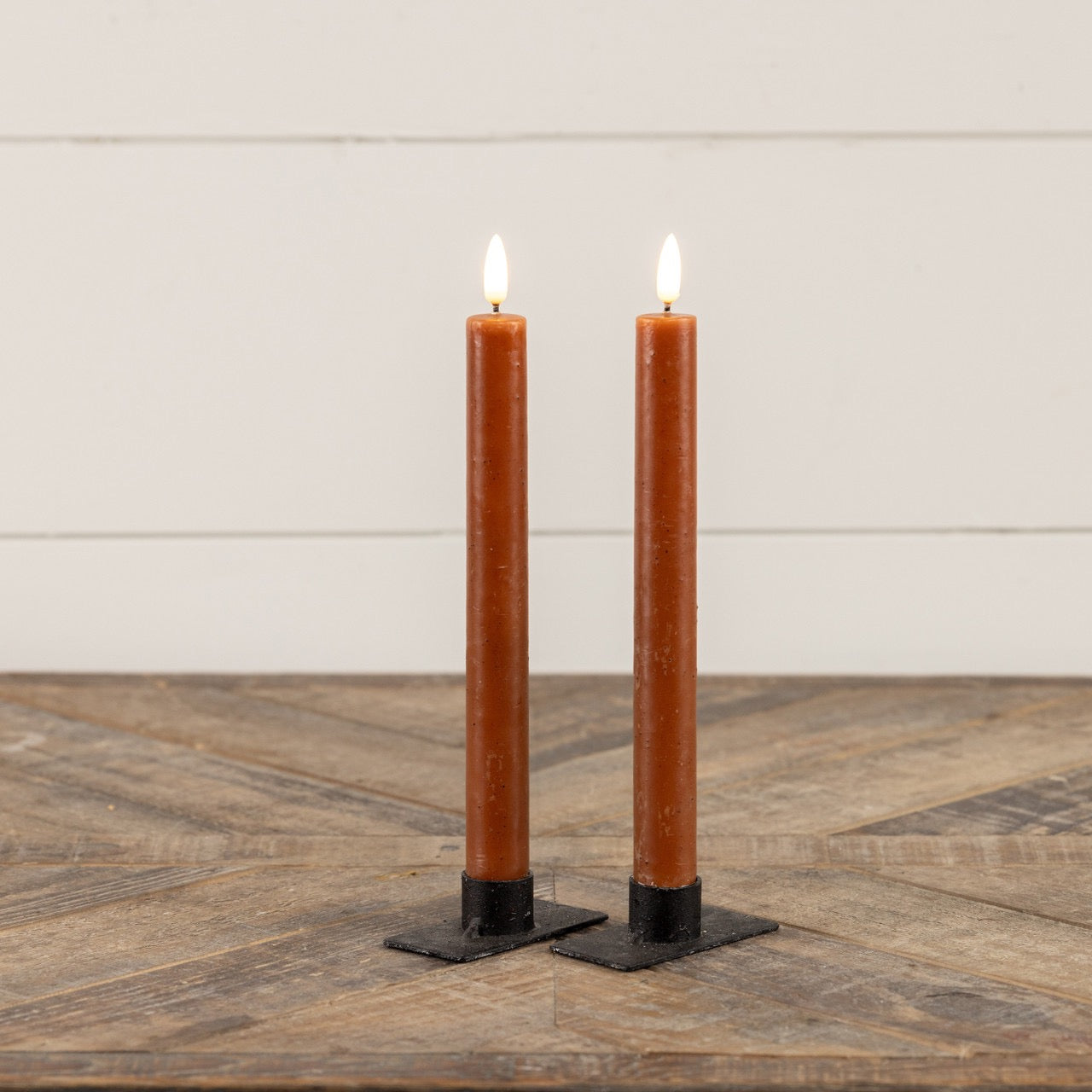 Bronze taper candle set with realistic 3D flame, elegantly displayed on a wooden surface. Perfect for vintage-inspired home decor.