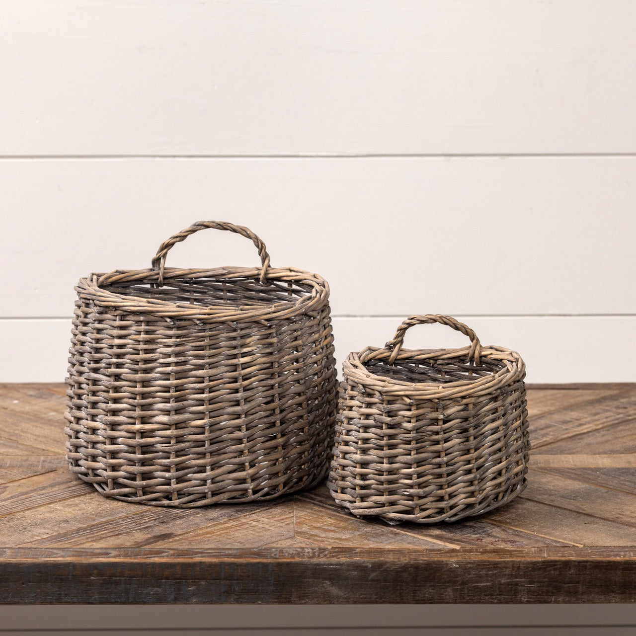 Set of 2 gray woven hanging baskets for home decor storage. Stylish and functional, perfect for organizing or displaying plants in any space.